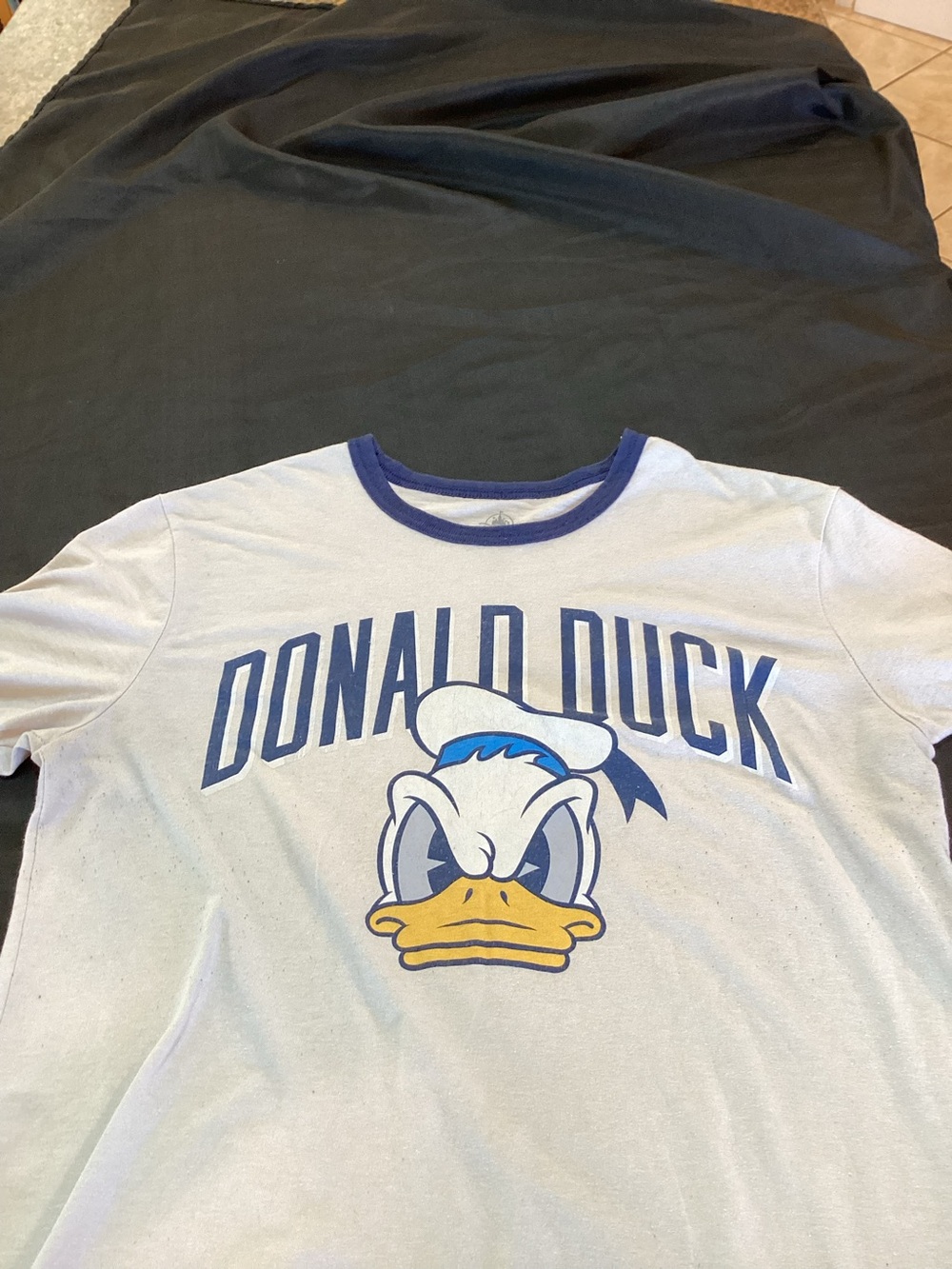 Donald Duck ,Graphic Ringer Tee ,- White with Blue Trim,Size Large 
I